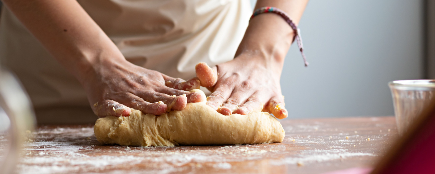 Dough for sweet potato biscuit being rolled out.