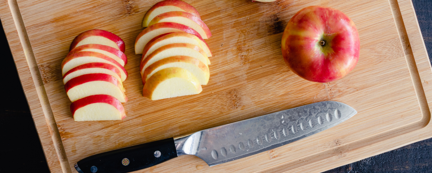 Apples being cut up for apple coleslaw.