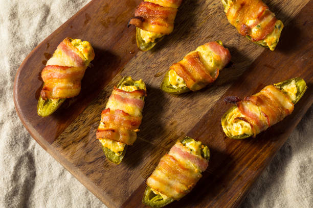 homemade bacon wrapped jalapeno poppers - jalapeno poppers stock pictures, royalty-free photos & images