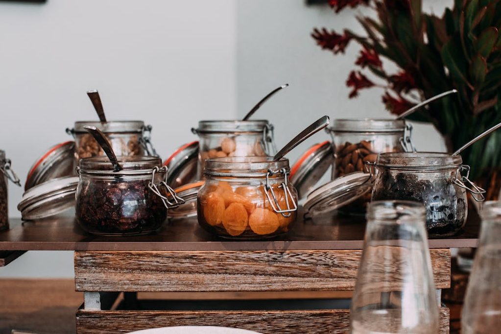 Jars with spices and prunes for Prune Cake