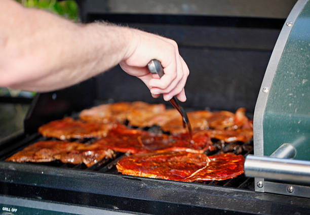 marinated carne asada on grill - carne asada meat stock pictures, royalty-free photos & images