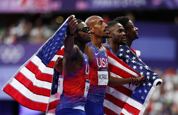 Gold medalists and new Olympic record holders Christopher Bailey, Vernon Norwood, Bryce Deadmon and Rai Benjamin of Team United States celebrate...