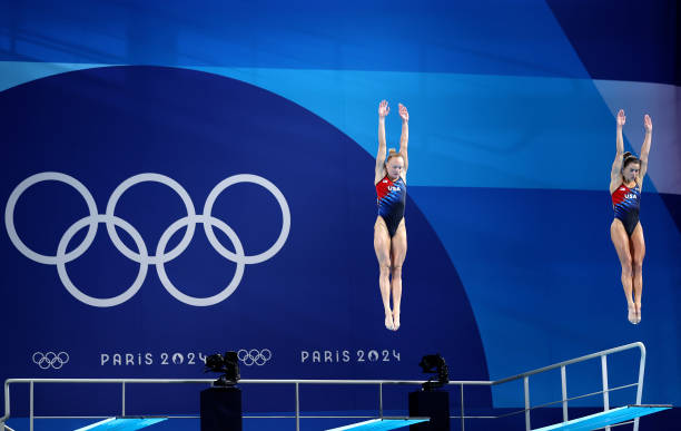 Sarah Bacon and Kassidy Cook of Team United States compete in the Women's Synchronised 3m Springboard Final on day one of the Olympic Games Paris...