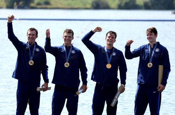 Gold medalists Nick Mead, Justin Best, Michael Grady and Liam Corrigan of the United States celebrate on the podium at the Rowing Men's Four medal...