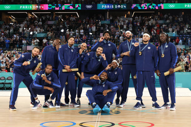 Gold medalists Team United States pose for a photo during the Men's basketball medal ceremony on day fifteen of the Olympic Games Paris 2024 at Bercy...