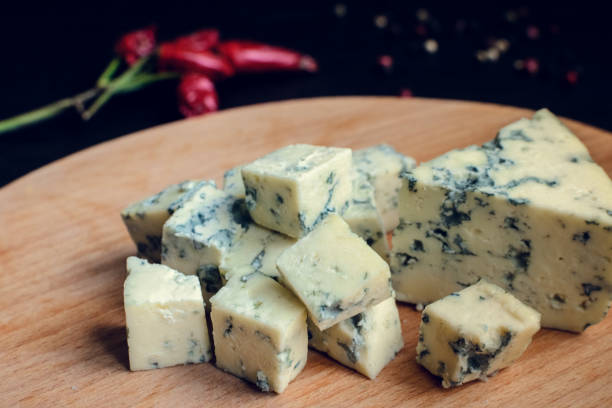 blue cheese on wooden board - blue cheese dressing stock pictures, royalty-free photos & images