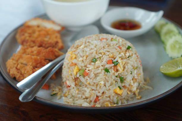 fried rice with fried chicken - egg fried rice stock pictures, royalty-free photos & images