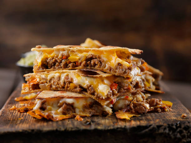 cheesy beef taco quesadilla - quesadilla stock pictures, royalty-free photos & images