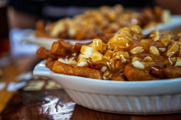 poutine - poutine stock pictures, royalty-free photos & images