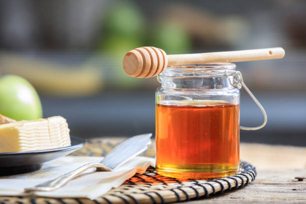 honey and butter on a table - honey butter stock pictures, royalty-free photos & images