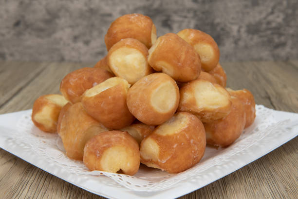 sweet treat from the bakery. - donut holes glazed stock pictures, royalty-free photos & images