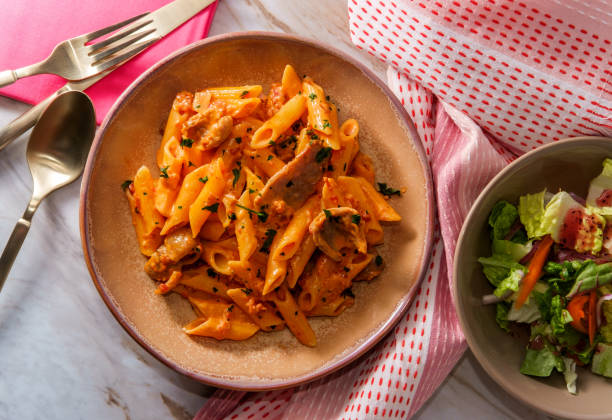 penne alla vodka sausage - vodka sauce parsley stock pictures, royalty-free photos & images