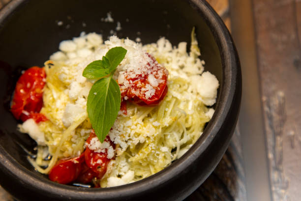 spaghetti from pupunha with pesto and goat cheese. - feta spaghetti squash stock pictures, royalty-free photos & images