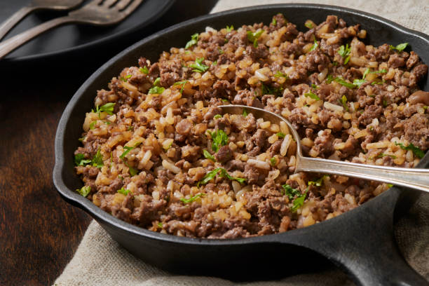 asian style ground beef and rice skillet - cooking ground beef and rice stock pictures, royalty-free photos & images