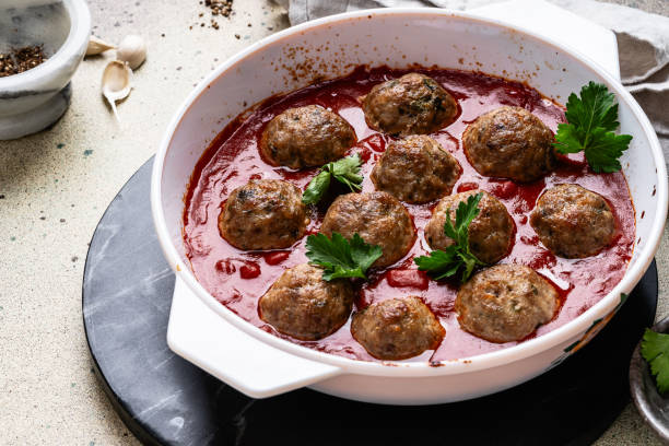 meatballs in tomato sauce, traditional italian polpette, preparing food, close up - cranberry glazed turkey meatballs stock pictures, royalty-free photos & images