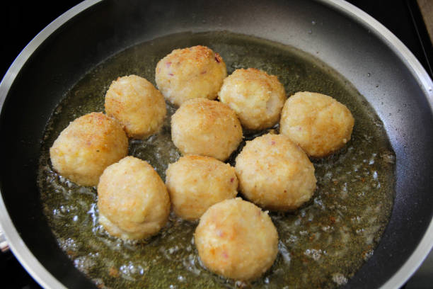 meatballs - frying arancini balls stock pictures, royalty-free photos & images