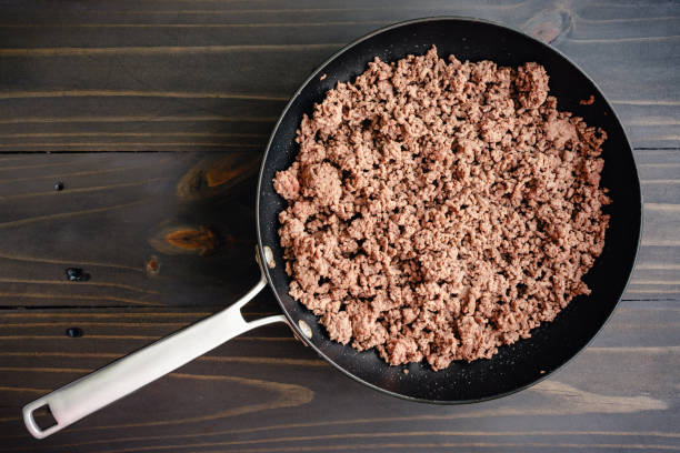 browned ground beef in a large skillet - ground beef stock pictures, royalty-free photos & images