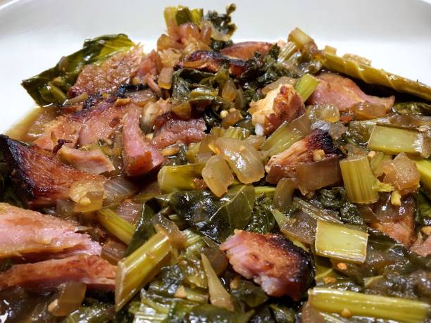 country ham and collard greens - collard greens with ham stock pictures, royalty-free photos & images