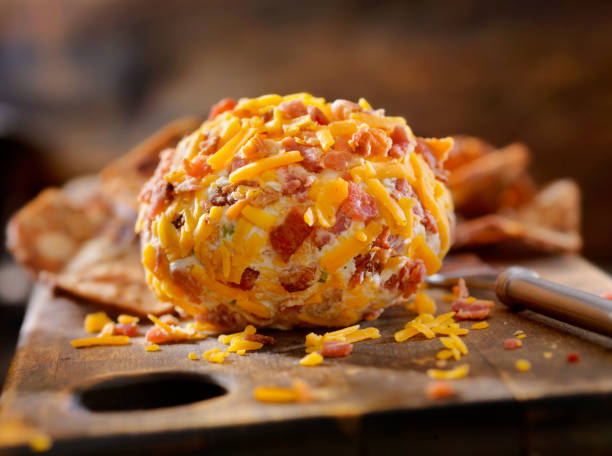 bacon and cheddar cheese ball with crackers - bacon and cheese ball stock pictures, royalty-free photos & images