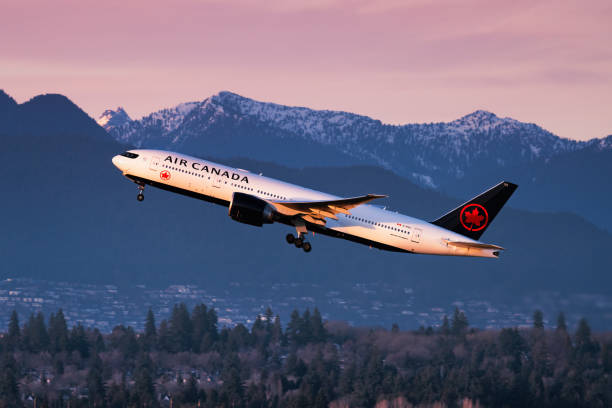 air canada boeing 777 taking off from vancouver international airport - air canada stock pictures, royalty-free photos & images