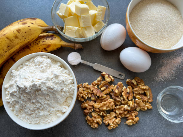 ingredients for banana bread on a concrete background - banana bread batter stock pictures, royalty-free photos & images