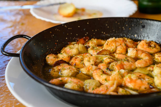 sautéed shrimp with garlic - gralic paprika shrimp stock pictures, royalty-free photos & images