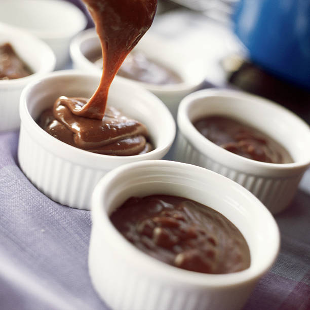 close-up of dessert in bowls. - sticky toffee pudding stock pictures, royalty-free photos & images