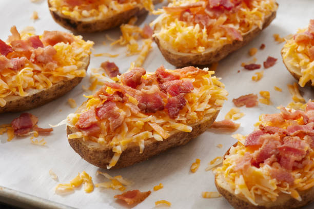 preparing loaded twice baked potato - making twice baked potatoes stock pictures, royalty-free photos & images