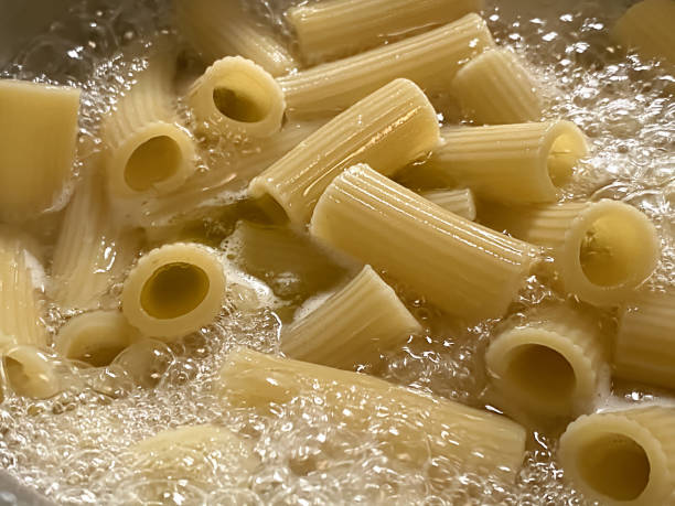 boiling pasta - rigatoni boiling stock pictures, royalty-free photos & images