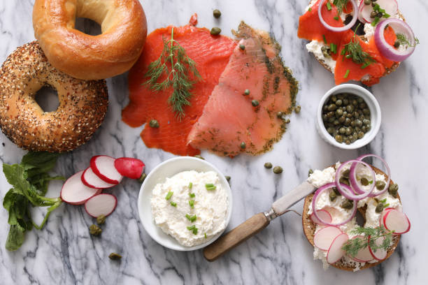 bagels, cream cheese and lox - lox bagel ingredients stock pictures, royalty-free photos & images