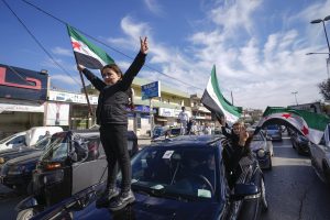 Jubilation and gunfire as Syrians celebrate the end of the Assad family’s half-century rule