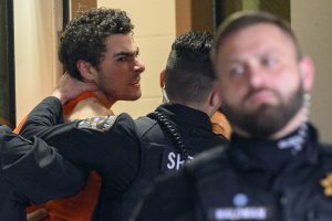 Suspect in the killing of UnitedHealthcare’s CEO struggles, shouts while entering courthouse