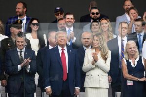 Military parade rolls through DC as ‘No Kings’ protesters across US decry Trump